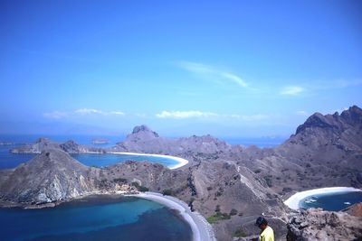 Scenic view of mountains against blue sky