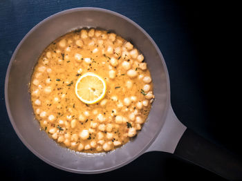 Top view of mini scallops in creamy herbed butter and lemon sauce