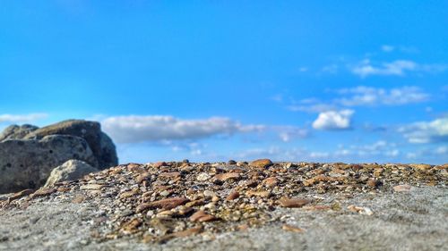 Pebbles against blue sky