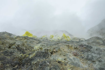 Scenic view of volcanic landscape against sky