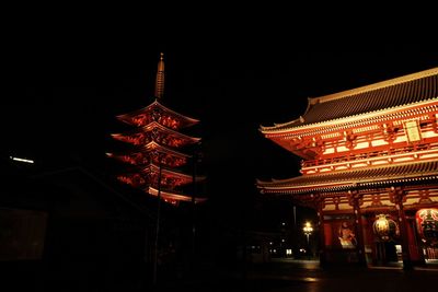 Low angle view of illuminated building at night