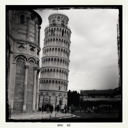 Ancient structure against cloudy sky