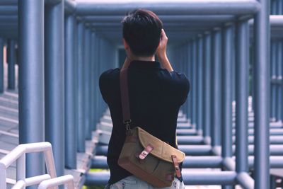 Rear view of woman standing in park