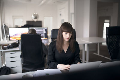 Businesswoman sitting in office