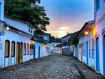 Street amidst buildings against sky