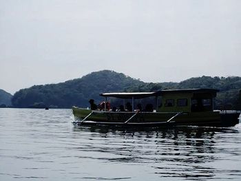 Calm lake with mountains in background