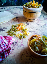 High angle view of chopped vegetables in bowl on table