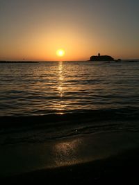 Scenic view of sea against romantic sky at sunset