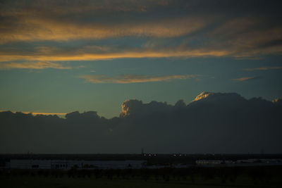 Scenic view of silhouette mountains against sky at sunset