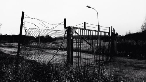 Barbed wire fence on field