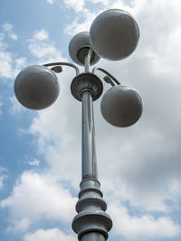 Low angle view of street light against sky