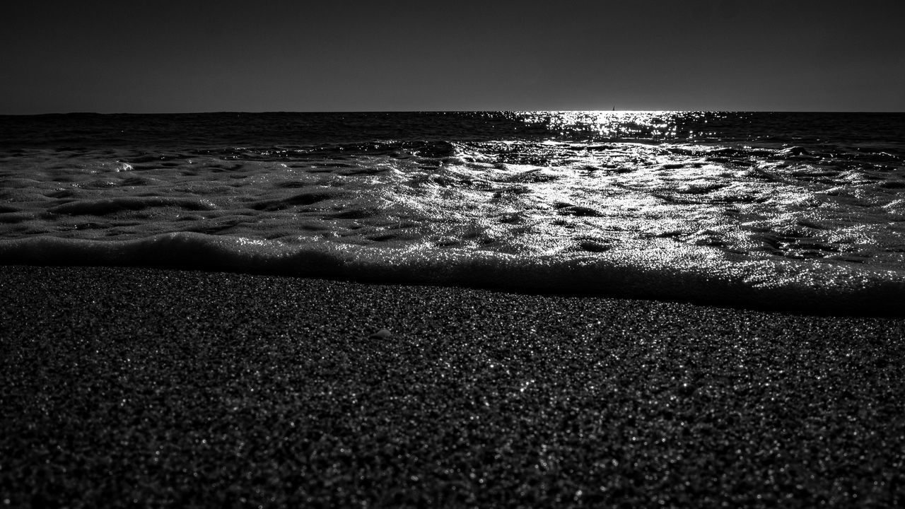 sea, water, horizon, black and white, land, beach, black, darkness, monochrome, monochrome photography, sky, horizon over water, nature, wave, beauty in nature, light, motion, scenics - nature, white, tranquility, ocean, no people, sand, water sports, outdoors, tranquil scene, sports, night, cloud, rock, wind wave, reflection, coast, idyllic