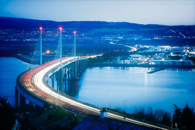 High angle view of illuminated bridge in city at night