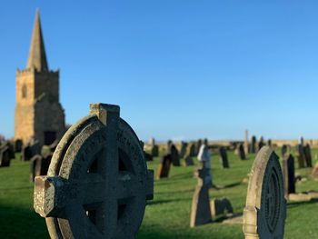 Cemetery against clear sky