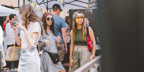 Group of people in traditional clothing standing in city