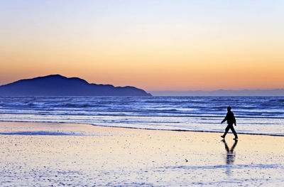 Scenic view of sea at sunset