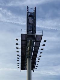 Low angle view of communications tower against sky