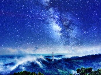 Scenic view of star field against blue sky