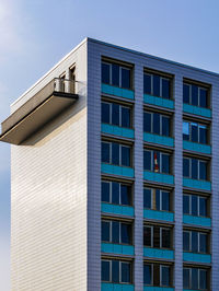 Low angle view of modern building against clear blue sky