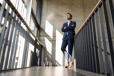 Businessman standing in staircase