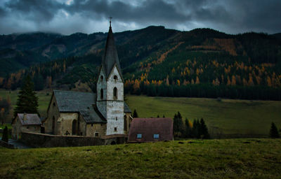 Scenic view of temple by building against sky