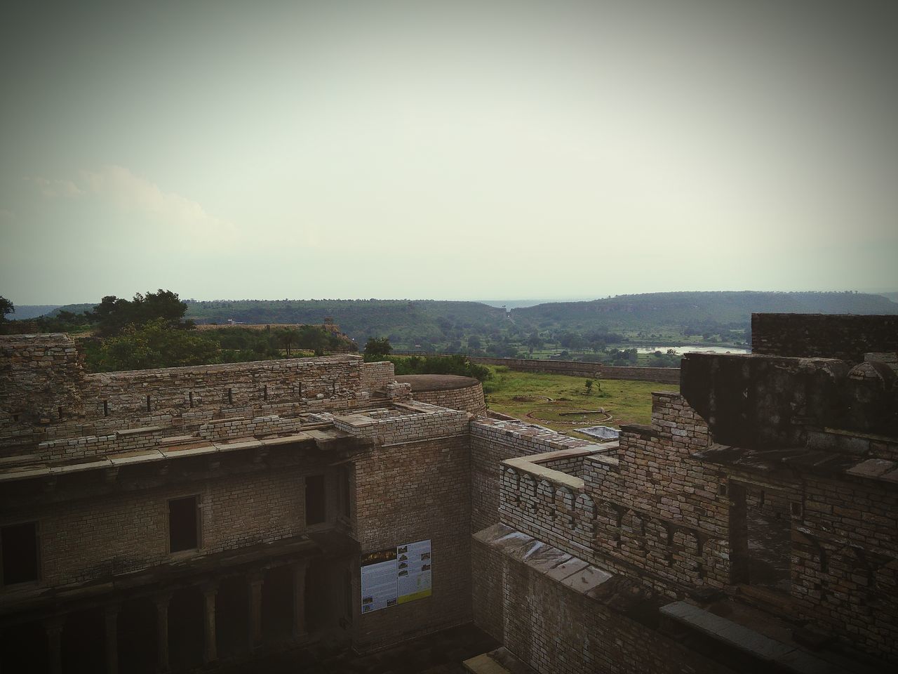 architecture, built structure, building exterior, clear sky, copy space, history, sky, high angle view, house, the past, day, old, auto post production filter, old ruin, outdoors, residential structure, no people, nature, tree, roof