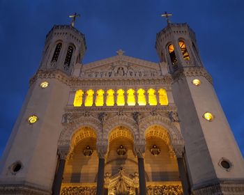 Low angle view of illuminated cathedral against sky