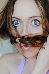 Close-up of young woman with hair around face