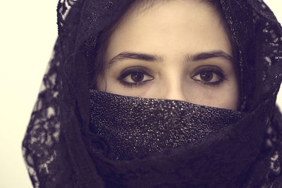 Close-up portrait of young woman wearing headscarf