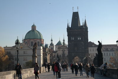 People on charles bridge against clear sky