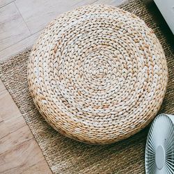 Directly above view of wicker container on mat at home