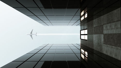 Directly below shot of modern building against clear sky