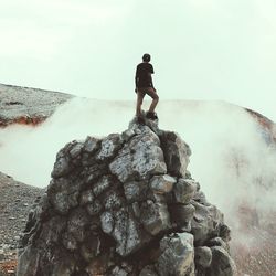 Man standing on rock formation