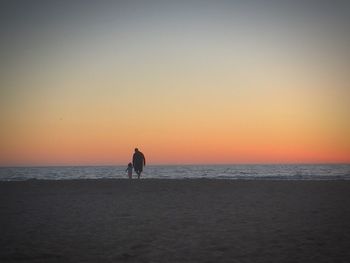 Scenic view of sea at sunset