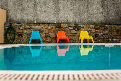 View of swimming pool against wall