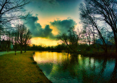 Scenic view of lake against sky during sunset