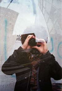 Man photographing with mobile phone