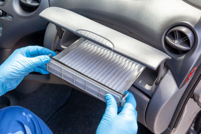 Cropped image of hand holding car