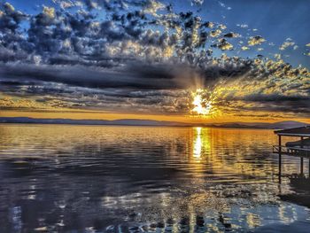 Scenic view of lake against sky during sunset