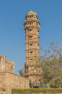 Low angle view of historical building against clear blue sky