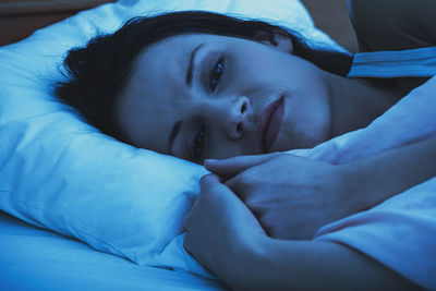 Close-up of baby sleeping on bed