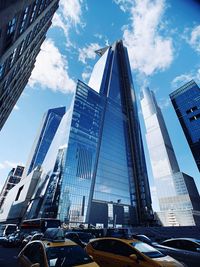 Low angle view of modern buildings against sky in city