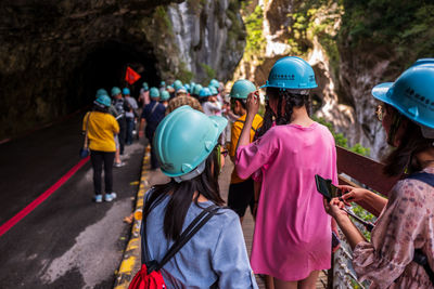 Group of people standing on the road