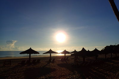 Scenic view of beach against sky during sunset