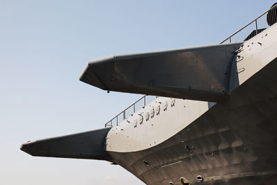 Low angle view of airplane flying against clear sky