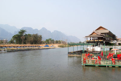 View of building and mountains against sky