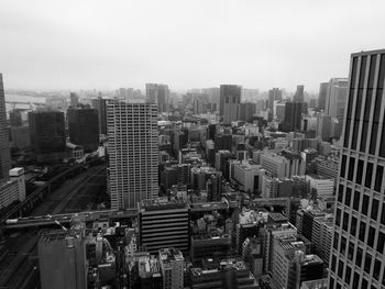 High angle view of buildings in city against sky