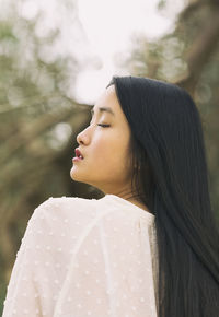 Chinese girl with plumeti blouse iv