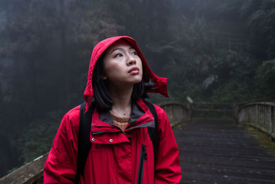 Portrait of beautiful young woman looking away