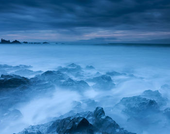 Scenic view of sea against sky during sunset